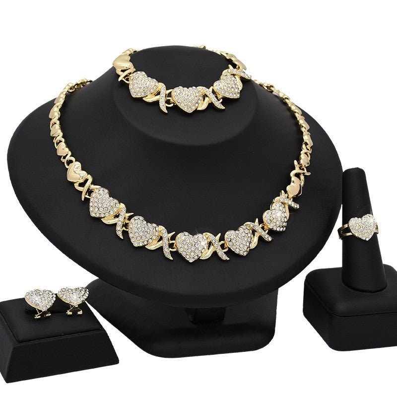 Dubai 18K Gold Heart-shaped Jewelry Suit $59.00 Dana Fashion Color: X13 Light Gold Women's Accessories Product information: Pattern: as shown in the figure Treatment Process: Electroplating Chain style: water wave chain Material: Alloy Applicable people: