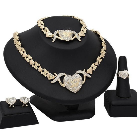 Dubai 18K Gold Heart-shaped Jewelry Suit $59.00 Dana Fashion Color: X14 Light Gold Women's Accessories Product information: Pattern: as shown in the figure Treatment Process: Electroplating Chain style: water wave chain Material: Alloy Applicable people: