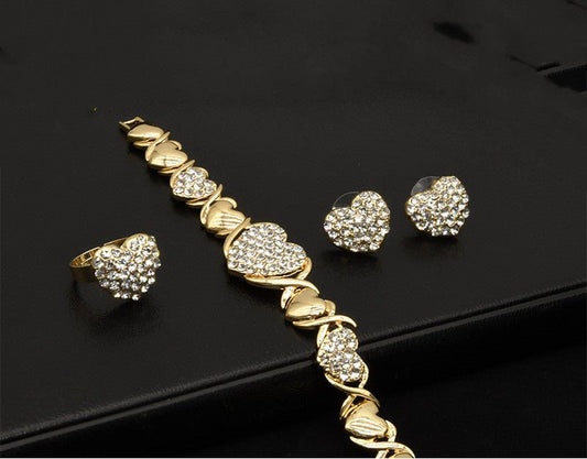 Dubai 18K Gold Heart-shaped Jewelry Suit $59.00 Dana Fashion Color: X12 Light Gold Women's Accessories Product information: Pattern: as shown in the figure Treatment Process: Electroplating Chain style: water wave chain Material: Alloy Applicable people: