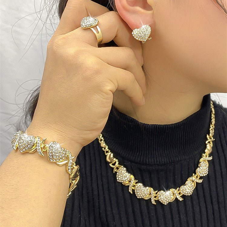 Dubai 18K Gold Heart-shaped Jewelry Suit $59.00 Dana Fashion Color: X12 Light Gold Women's Accessories Product information: Pattern: as shown in the figure Treatment Process: Electroplating Chain style: water wave chain Material: Alloy Applicable people: