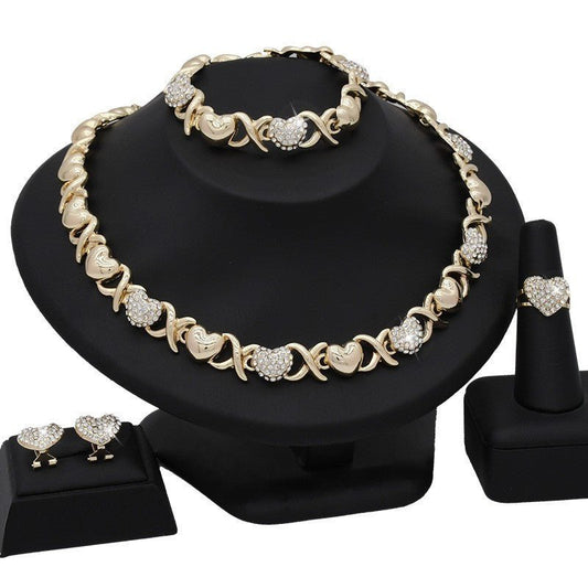 Dubai 18K Gold Heart-shaped Jewelry Suit $59.00 Dana Fashion Color: X12 Light Gold Women's Accessories Product information: Pattern: as shown in the figure Treatment Process: Electroplating Chain style: water wave chain Material: Alloy Applicable people: