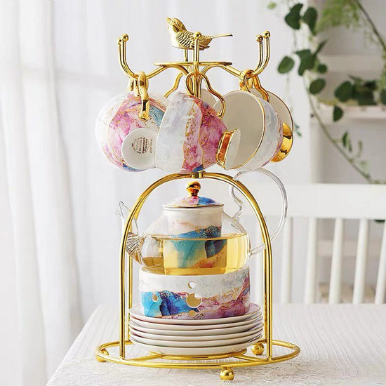 English Ceramic Glass Flower Tea Cup Set $479.21 Dana Fashion style: A Dana's Kitchen Product information: Product name: Qianhe Hongyan glass flower tea set Material: bone china, glass Craft: Gilt/Paper Craft Capacity: pot 600ML/cup 200ML Color: Qianhe gl