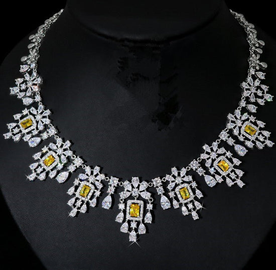 European And American Fashion Retro Square Zircon Necklace Earrings $317.42 Dana Fashion Color: Yellow Zirconium Women's Accessories Product information: Pendant material: mixed gem inlaid Chain style: O-ring chain Material: zircon Popular elements: round