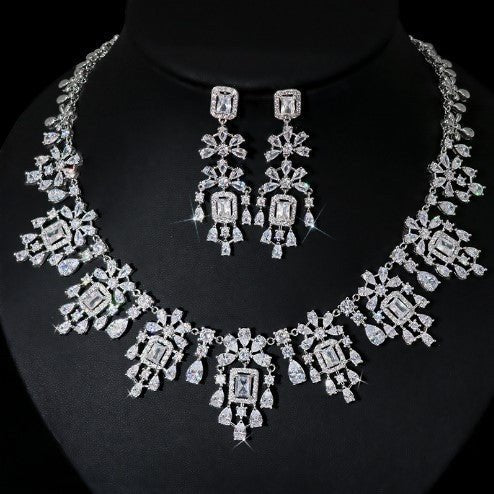 European And American Fashion Retro Square Zircon Necklace Earrings $317.42 Dana Fashion Color: White Zirconium Women's Accessories Product information: Pendant material: mixed gem inlaid Chain style: O-ring chain Material: zircon Popular elements: round,