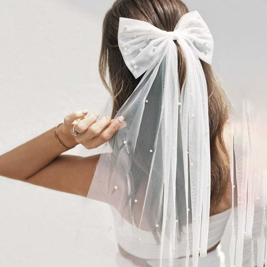European And American Mesh Models Hair Accessories Nail Pearl Bow Decorative Hair Clip $10.00 Dana Fashion Color: White Women's Accessories Product information: Pattern: solid color Processing Technology: manual Type: barrettes. Color: White Material: Mes