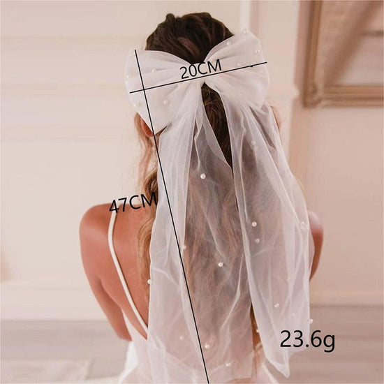 European And American Mesh Models Hair Accessories Nail Pearl Bow Decorative Hair Clip $10.00 Dana Fashion Color: White Women's Accessories Product information: Pattern: solid color Processing Technology: manual Type: barrettes. Color: White Material: Mes
