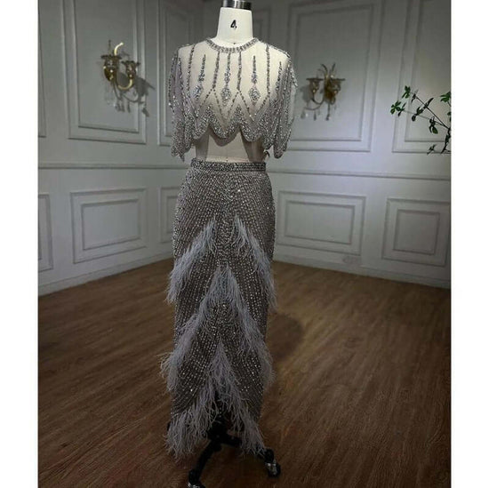 European And American Silver Nude Slim-fit Feather Shawl Host Performance Ladies' Evening Dress $799.00 Dana Fashion Color: Silver Nude Size: L Women's clothing Product information: Fabric name: Organza Applicable scenarios: Wedding, hosting, party, eveni
