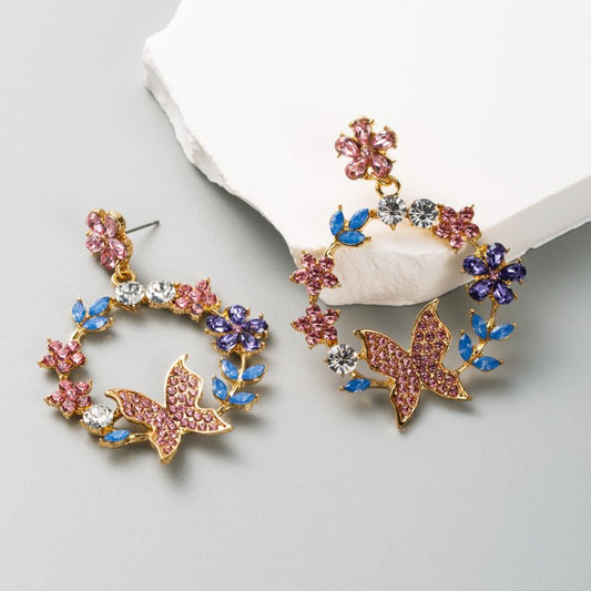 Exaggerated Alloy Diamond Garland Butterfly Earrings $15.61 Dana Fashion Color: AB Color Women's Accessories Product information: Treatment Process: Diamond Color: AB color, white Green Red Applicable population: Female Material: Alloy Modeling: Flower, a