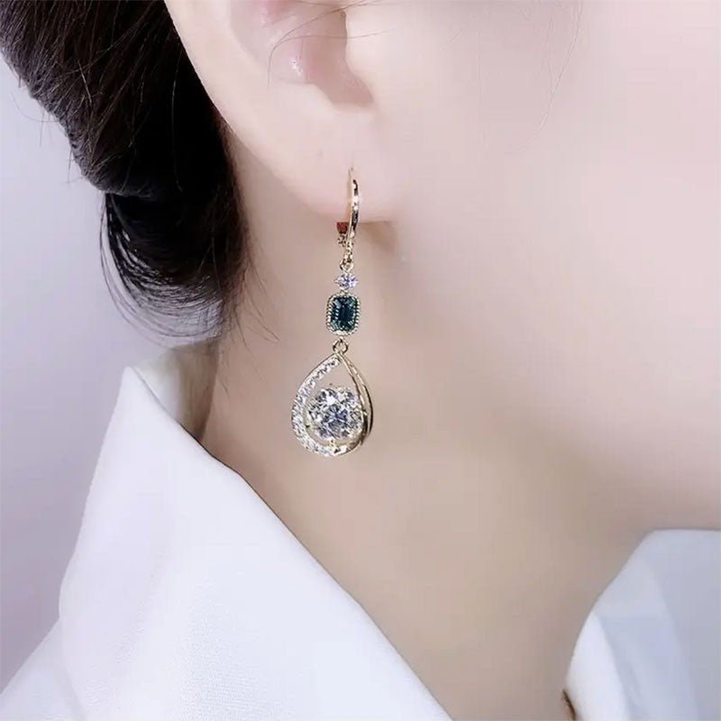Exquisite Light Luxury High-grade Diamond-embedded Water Drop Earrings $21.99 Dana Fashion Color: Golden Ear Clip Women's Accessories Product information: Treatment Process: Diamond Color: gold ear clip Applicable people: women Style: Women's Material: Al
