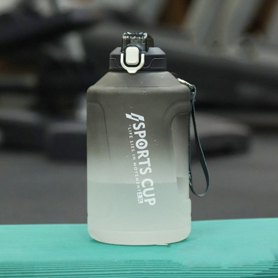 Extra Large Capacity Cup With Straw Fitness Sports Water Bottle Fitness Big Bottles $46.38 Dana Fashion Color: Gradient Black Capacity size: 2.3L style: Straw Dana's Kitchen Product information: Style: sports Function: high temperature resistance Dimensio