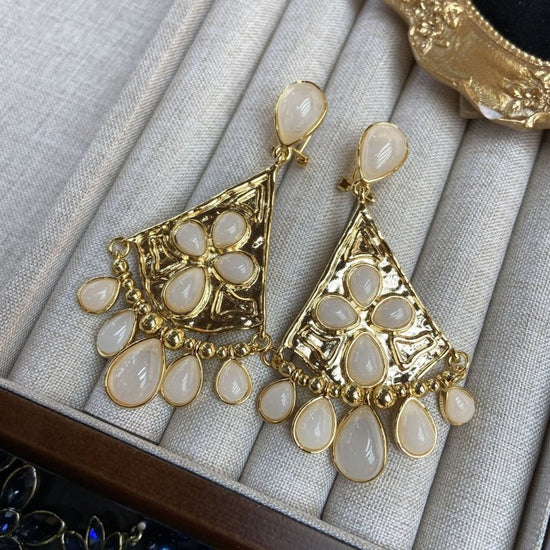 Fan-shaped White Jade Tassel Earrings Water Drop Long Ear Studs $29.50 Dana Fashion Color: White Jade Women's Accessories Product information: Color: fan-shaped white jade tassel earrings Applicable people: women Material: Copper Modeling: Constellation,