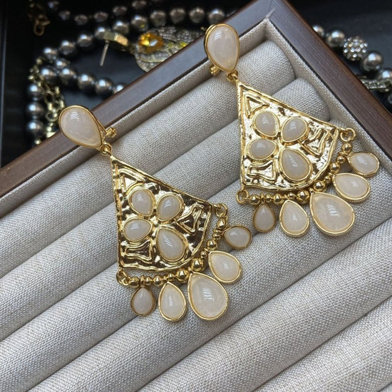Fan-shaped White Jade Tassel Earrings Water Drop Long Ear Studs $29.50 Dana Fashion Color: White Jade Women's Accessories Product information: Color: fan-shaped white jade tassel earrings Applicable people: women Material: Copper Modeling: Constellation,