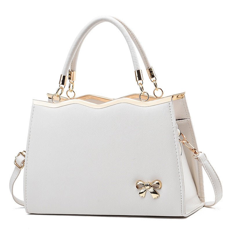 Fashion Bowknot Handbag Large Capacity Shoulder Messenger Bag $43.78 Dana Fashion Color: White Women's Bags Product information: Color: bright red, black, royal blue, rose red, white, pink, wine red Hardness: medium Material: PU Suitcase shape: Horizontal