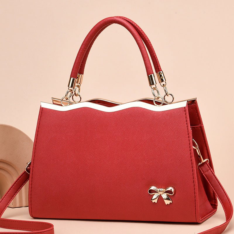 Fashion Bowknot Handbag Large Capacity Shoulder Messenger Bag $43.78 Dana Fashion Color: Black Women's Bags Product information: Color: bright red, black, royal blue, rose red, white, pink, wine red Hardness: medium Material: PU Suitcase shape: Horizontal