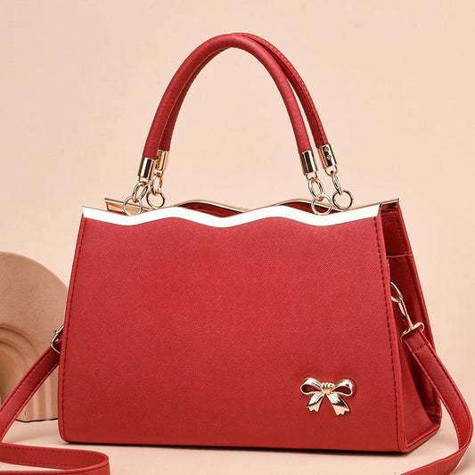 Fashion Bowknot Handbag Large Capacity Shoulder Messenger Bag $43.78 Dana Fashion Color: Black Women's Bags Product information: Color: bright red, black, royal blue, rose red, white, pink, wine red Hardness: medium Material: PU Suitcase shape: Horizontal