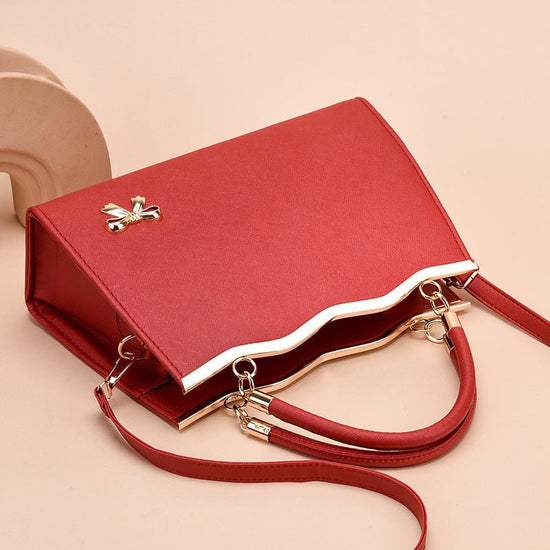 Fashion Bowknot Handbag Large Capacity Shoulder Messenger Bag $43.78 Dana Fashion Color: Black Women's Bags Product information: Color: bright red, black, royal blue, rose red, white, pink, wine red Hardness: medium Material: PU Suitcase shape: Horizontal