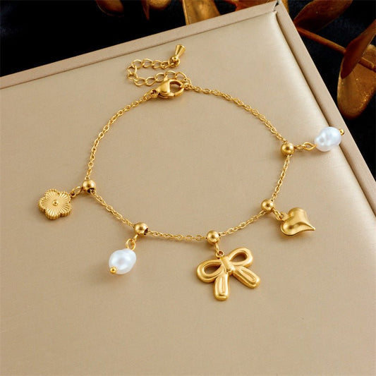 Fashion Bowknot Pearl Heart Drop Oil Contrast Color Bracelet $16.13 Dana Fashion Color: B1504 Women's Accessories Product information: Treatment Process: Electroplating Color: 168.04,168.05,168.06 Applicable population: Female Applicable occasions for gif