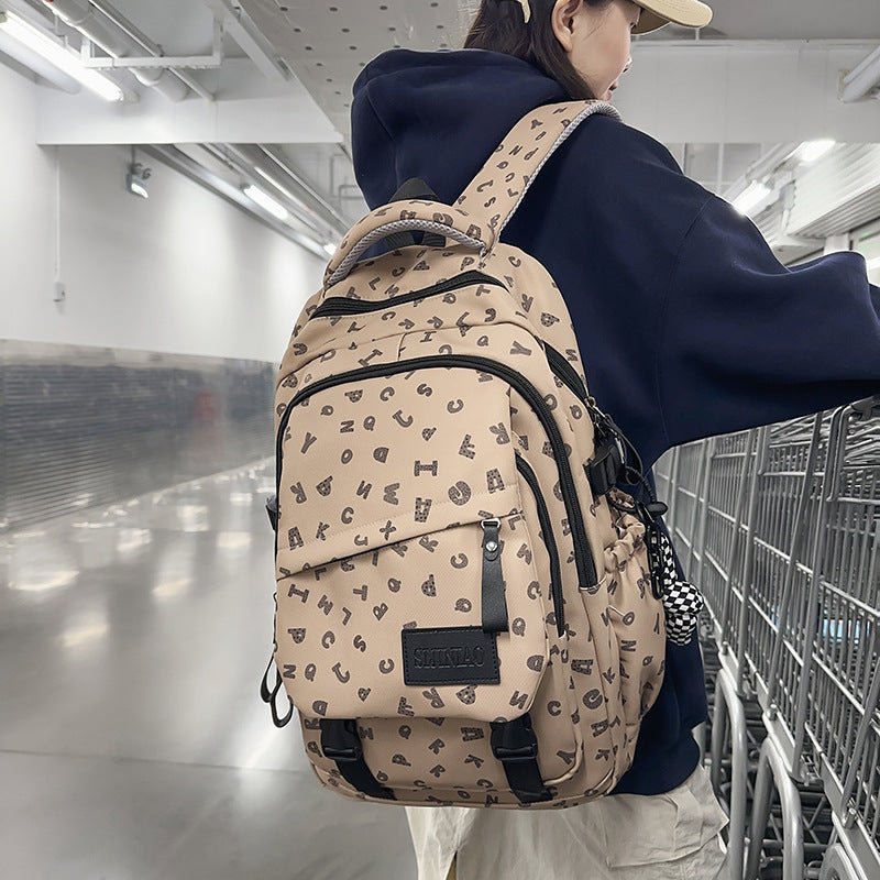 Fashion Casual All Matching Backpack $56.50 Dana Fashion Color: Brown Style: With Pendant Women's Bags Product information: Color: white and gray letters, white card letters, light khaki, dark khaki, Brown Applicable gender: neutral/both men and women Mat