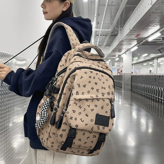 Fashion Casual All Matching Backpack $56.50 Dana Fashion Color: Brown Style: With Pendant Women's Bags Product information: Color: white and gray letters, white card letters, light khaki, dark khaki, Brown Applicable gender: neutral/both men and women Mat