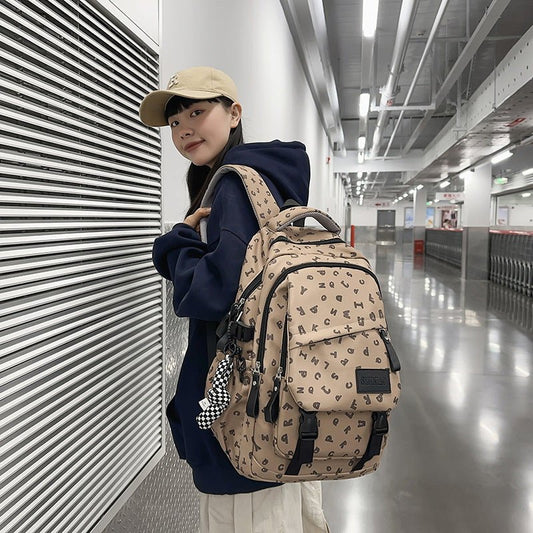 Fashion Casual All Matching Backpack $56.50 Dana Fashion Color: Brown Style: With Pendant Women's Bags Product information: Color: white and gray letters, white card letters, light khaki, dark khaki, Brown Applicable gender: neutral/both men and women Mat