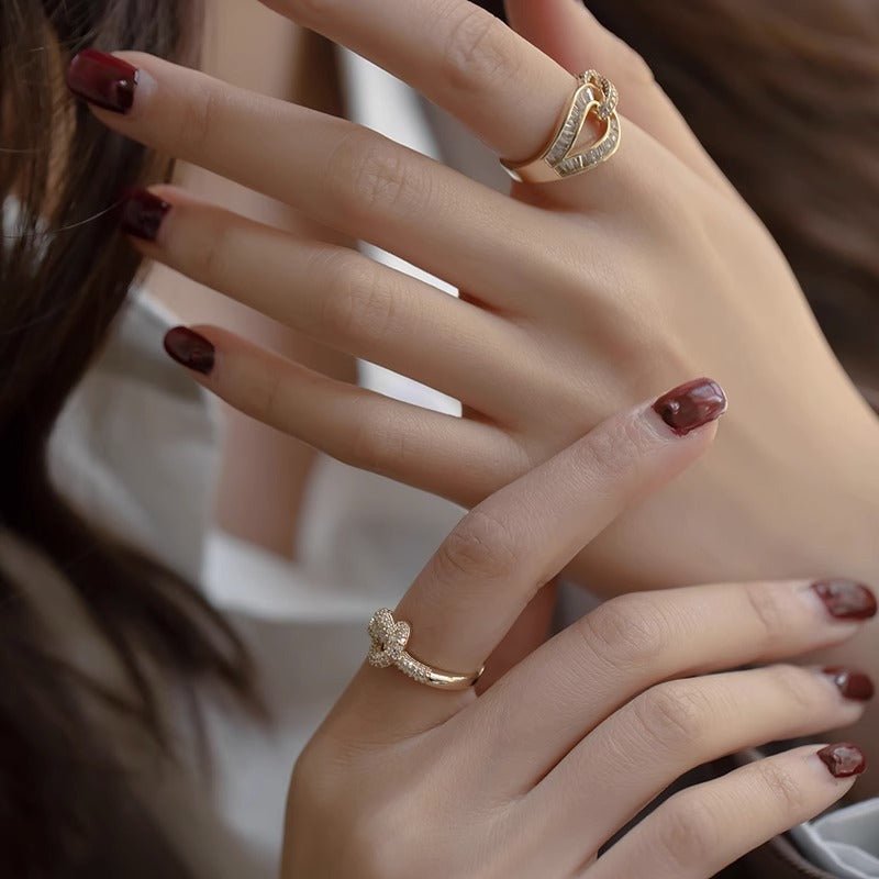 Fashion Micro-inlaid Zircon Ring Women $19.08 Dana Fashion Color: Gold Women's Accessories Product information: Type: Ring Treatment Process: Electroplating Color: Micro-inlaid split ring Style: Women's Material: Copper Style: Fashion Packing list: Ring *