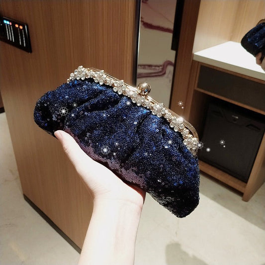 Female Blue Banquet Bag Chain Beads Handbag $42.28 Dana Fashion Color: Blue Women's Bags Product Introduction: Product category: dinner bag Material: bead Fabric texture: polyester Lining texture: acrylic Cover opening mode: latch Color: blue Size: 28 * 1