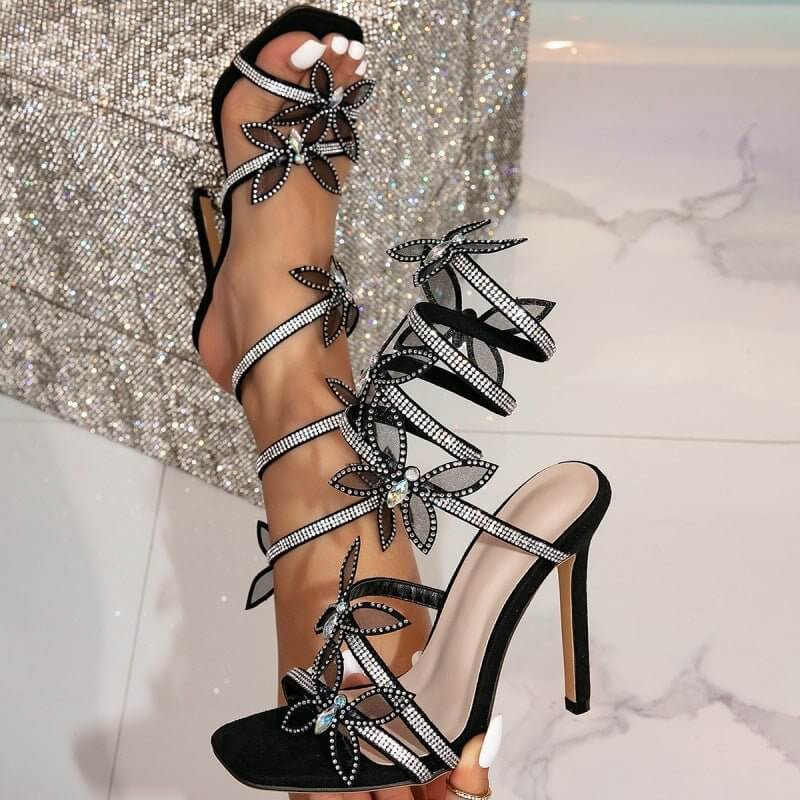 Female Snake Wrapped Open Toe Water Diamond Sandals $65.90 Dana Fashion Color: Black Size: 36 Women's shoes Product information: Thickness: ordinary thickness Pattern: color matching Toe holder shape: square head Color: Black Shoe Upper material: Satin So