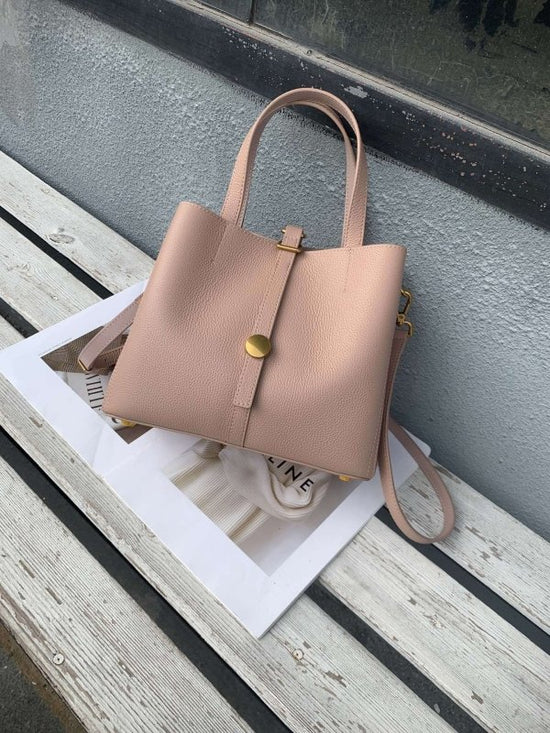 First Layer Cowhide Tote Genuine Leather Women $145.00 Dana Fashion Color: Taro Color Women's Bags Product information: Lining texture: Polyester Applicable scenario: leisure travel Color: black, khaki, dark blue, taro, wine red, gray Outer bag type: Sand