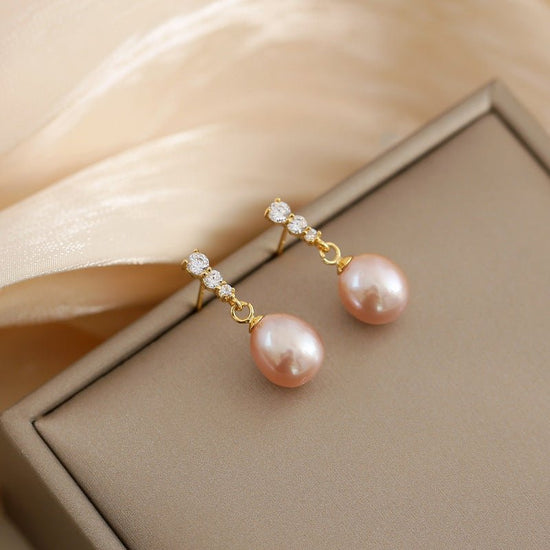 French Style All-match Fashion Earrings $14.99 Dana Fashion Color: Pink Women's Accessories Product information: Treatment Process: Electroplating Color: oval pearl zircon earrings-white, oval pearl zircon earrings-pink Applicable population: Female Mater