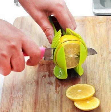 Fruit & Veggie Cutting Holder $15.00 Dana Fashion Color: Black Dana's Kitchen Feature Made from high duty plastic material Creative design / Eco-friendly / non-toxic Quick & easy to use and clean. Specification 100% brand new and high quality Size:( 18.5*