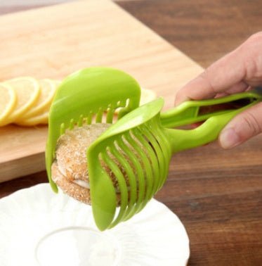 Fruit & Veggie Cutting Holder $15.00 Dana Fashion Color: Black Dana's Kitchen Feature Made from high duty plastic material Creative design / Eco-friendly / non-toxic Quick & easy to use and clean. Specification 100% brand new and high quality Size:( 18.5*