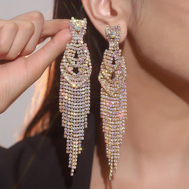 Full Diamond Long Tassel Women's Earrings $21.47 Dana Fashion Color: Golden AB Women's Accessories Product information: Color: gold, silver Applicable population: Female Material: Rhinestone Shape: Geometry Size: 12.8 * 1.8cm Packing list: Earrings*1Pair