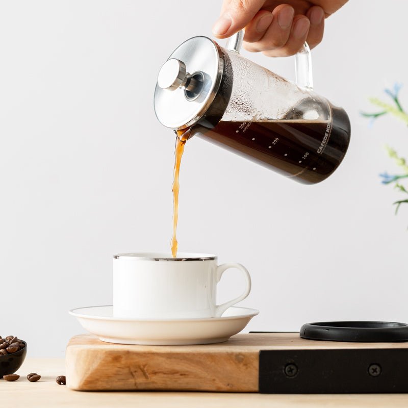 Glass Press Pot $32.35 Dana Fashion Color: Transparent Size: 350 ml Dana's Kitchen Model: CK8901 Material: Heat-resistant glass, stainless steel, PP, silicone Capacity: 350mL Color: black