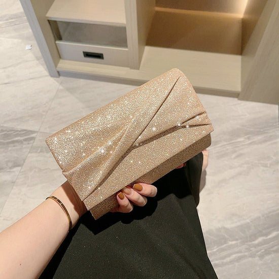 Gold Fashion Envelope Clutch $36.26 Dana Fashion Color: Cross Pouch Women's Bags Product information: Lining texture: Polyester Color: Cross pouch Hardness: hard Material: PU Suitcase shape: Horizontal Square Package internal structure: mobile phone bag P