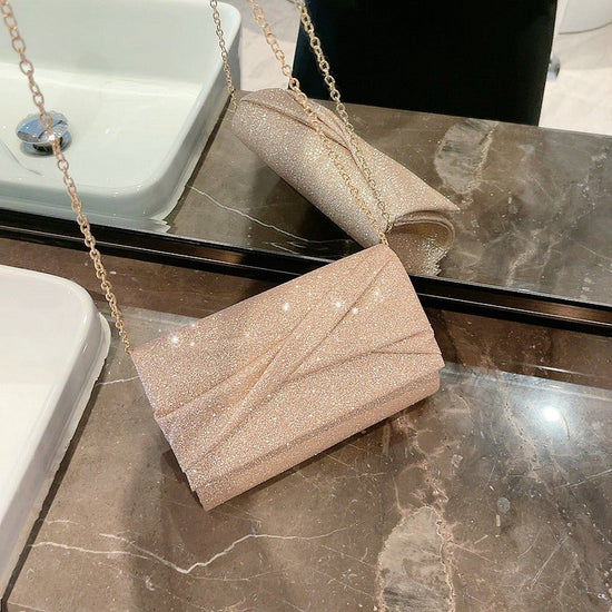 Gold Fashion Envelope Clutch $36.26 Dana Fashion Color: Cross Pouch Women's Bags Product information: Lining texture: Polyester Color: Cross pouch Hardness: hard Material: PU Suitcase shape: Horizontal Square Package internal structure: mobile phone bag P