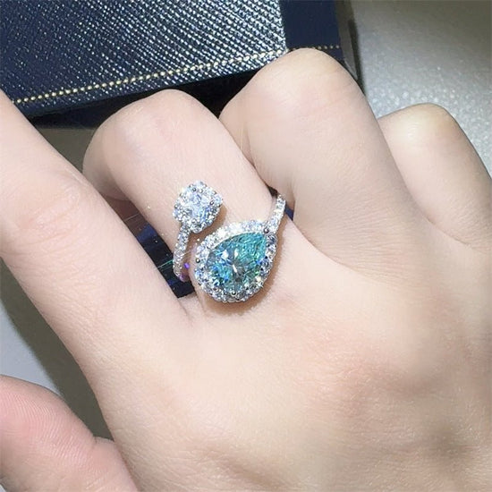 Green Drip 2 Karat Moissanite Women's Ring $149.00 Dana Fashion Color: 2 Karat Green Size: No 10 Women's Accessories Product information: Type: Ring Treatment Process: Diamond Color: 2 karat green water drops moissanite ring Applicable people: women Size: