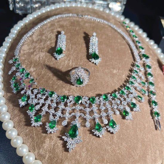 Green Waterdrops Zircon Necklace Earring Ring Bracelet Four-piece Set $362.50 Dana Fashion Color: Emerald Green Women's Accessories Product information: Material: zircon/Rhinestone Product Type: Ornament Color classification: Emerald Green Size: Necklace
