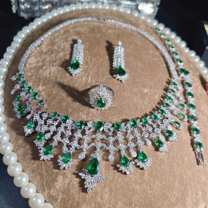Green Waterdrops Zircon Necklace Earring Ring Bracelet Four-piece Set $362.50 Dana Fashion Color: Emerald Green Women's Accessories Product information: Material: zircon/Rhinestone Product Type: Ornament Color classification: Emerald Green Size: Necklace
