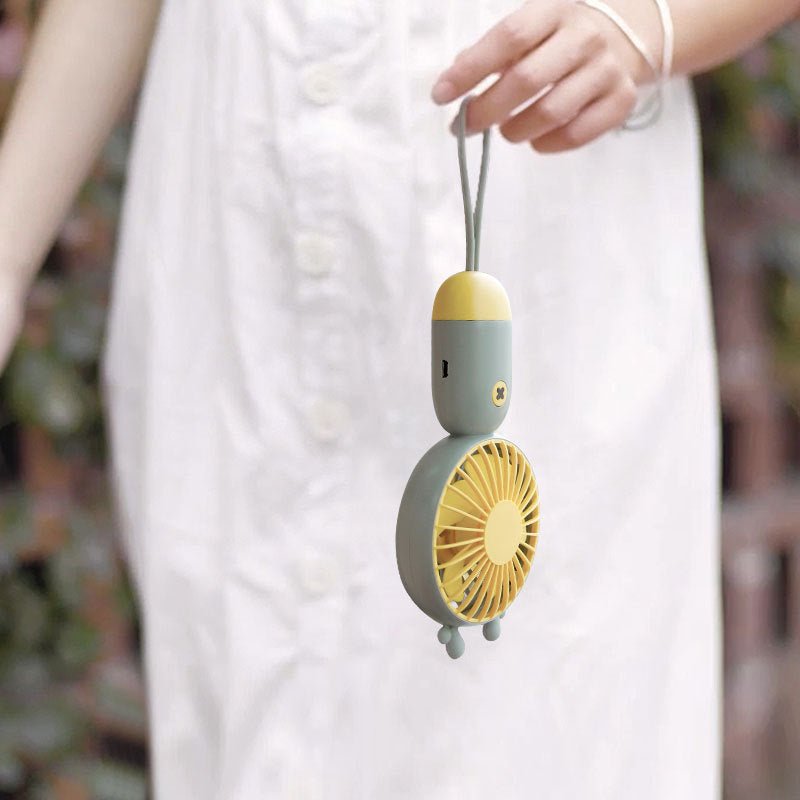 Handheld portable mini fan $38.12 Dana Fashion Color: Green Toys & Hobbies Product name: cute hand-held fan Rated voltage: 3.7V Rated power: 1.5W Battery capacity: 500mAh Material: ABS + silicone Charging time: 2 hours Working time: 2.5-4 hours (depending