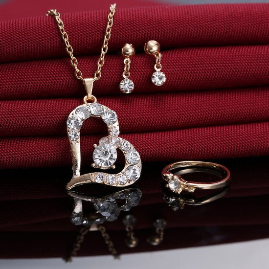 Heart Pendant Jewelry Set Rhinestone Jewellery $21.99 Dana Fashion Color: A Women's Accessories Product material: alloy Product size: pendant 30 * 22mm, earring 14 * 4mm, ring diameter 20mm Product chain: 42cm