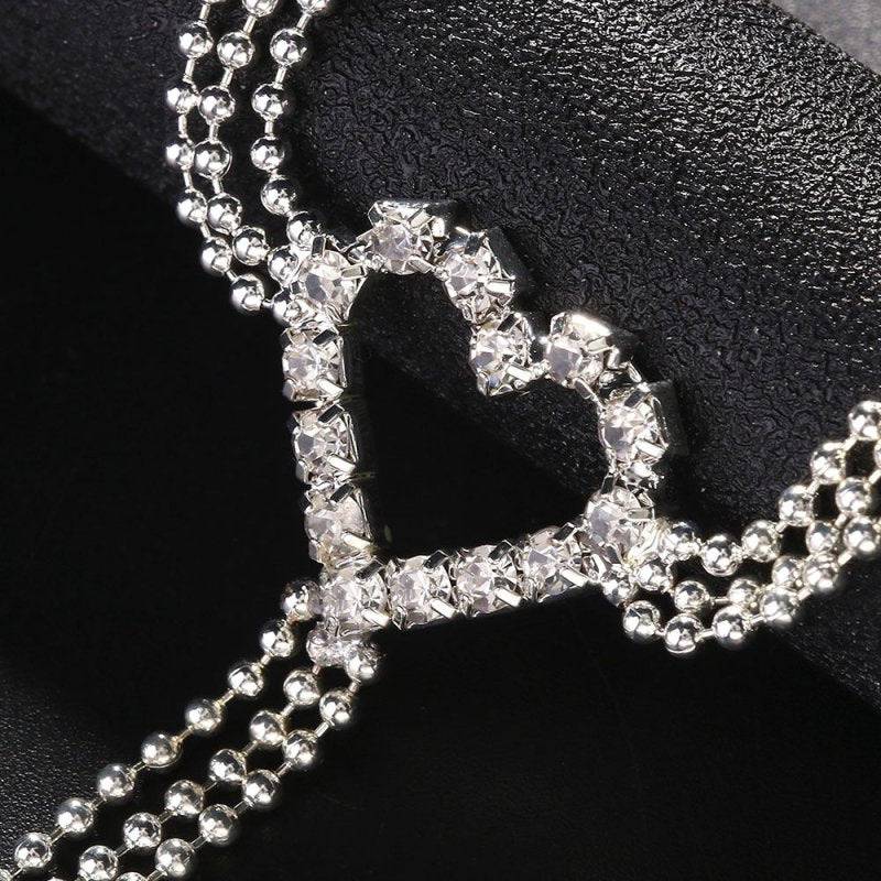 Heart-shaped Underwear European And American Rhinestone Body Chains Accessories $20.84 Dana Fashion Color: Silver Women's Accessories Product information: Color: gold, silver Inlaid material: alloy inlaid artificial gem/semi-precious stone Chain style: Bo