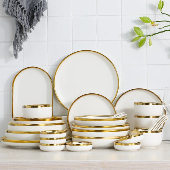 High-end tableware set $135.29 Dana Fashion Quantity: Q9pcs Set Dana's Kitchen Name: Nordic gold-plated tableware series Header: multiple configurations are optional Material: Ceramic Color: matte white Features: Delicate texture and multi-vessel type Pac
