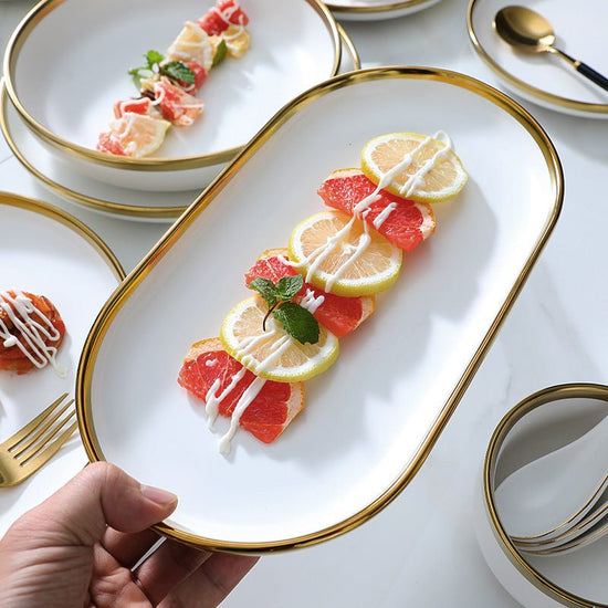High-end tableware set $135.29 Dana Fashion Quantity: Q9pcs Set Dana's Kitchen Name: Nordic gold-plated tableware series Header: multiple configurations are optional Material: Ceramic Color: matte white Features: Delicate texture and multi-vessel type Pac