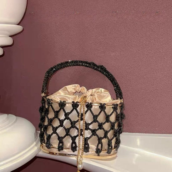 High-grade Heavy Hand-woven Shiny Rhinestone Strip Metal Birdcage Portable Basket $89.50 Dana Fashion Color: Black Women's Bags Product information: Lining texture: Nylon Color: silver, gold, black, green, colorful, light blue Material: Rhinestone Popular
