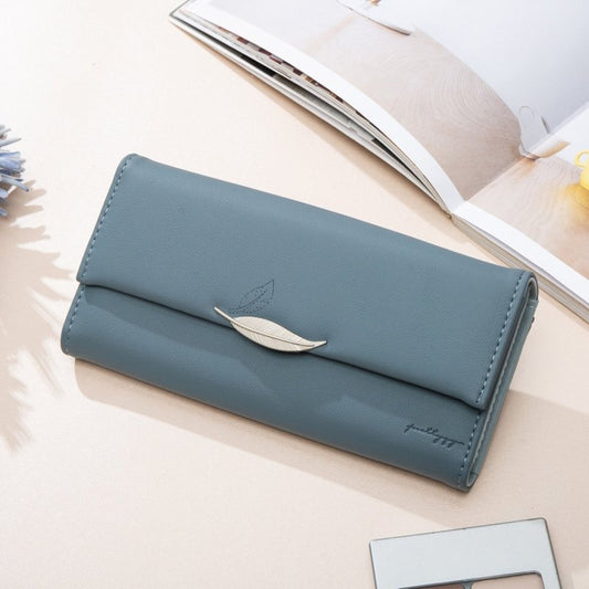 Hipster Style Leaf Buckle Simple Long Wallet Ladies $31.78 Dana Fashion Color: Orange Women's Bags Product information: Pattern: solid color Lining texture: Polyester Applicable scenario: Daily configuration Color: Orange Function: Zoom Material: PU leath