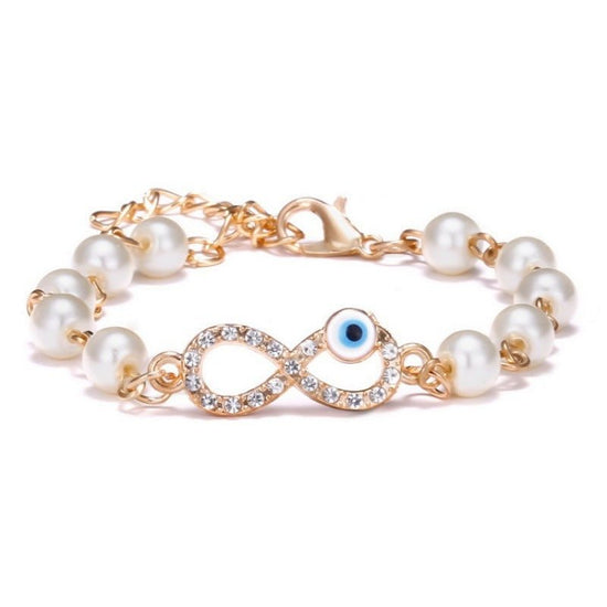 Hollow Rhinestone Pearl Bracelet Multi-style Adjustable $8.50 Dana Fashion Color: 8 Eyes Rhinestone Women's Accessories Product information: Treatment Process: Pearl Inlay Color: Cross, 8 words round, Moon XINGX, starfish, butterfly, heart-shaped wings, 8