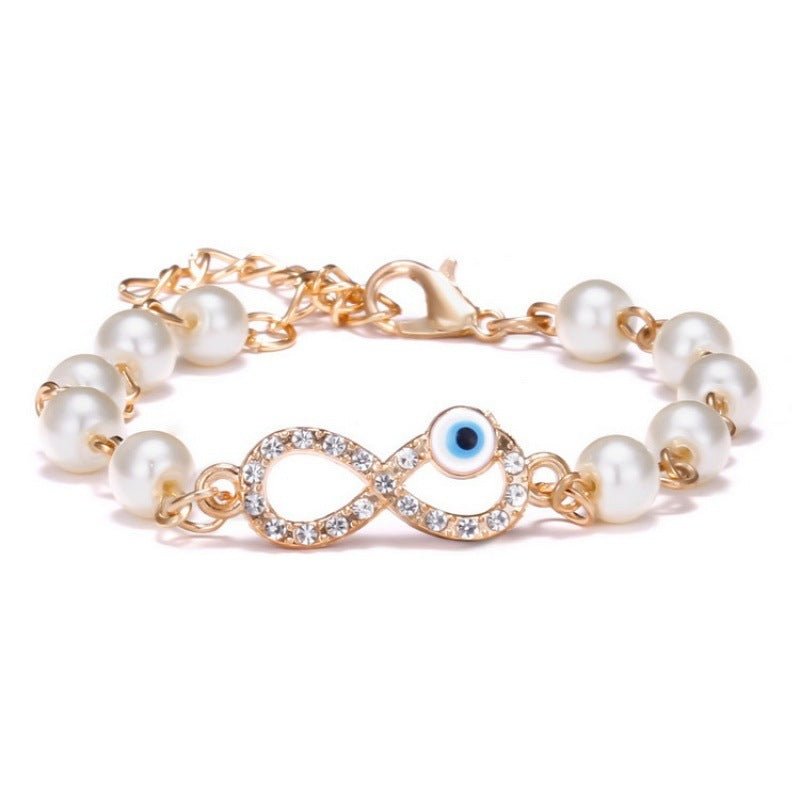 Hollow Rhinestone Pearl Bracelet Multi-style Adjustable $8.50 Dana Fashion Color: 8 Eyes Rhinestone Women's Accessories Product information: Treatment Process: Pearl Inlay Color: Cross, 8 words round, Moon XINGX, starfish, butterfly, heart-shaped wings, 8