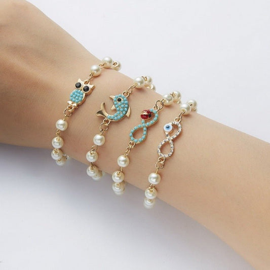 Hollow Rhinestone Pearl Bracelet Multi-style Adjustable $8.50 Dana Fashion Color: 8 Eyes Rhinestone Women's Accessories Product information: Treatment Process: Pearl Inlay Color: Cross, 8 words round, Moon XINGX, starfish, butterfly, heart-shaped wings, 8