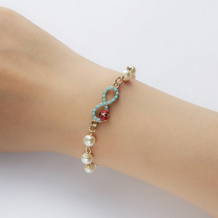 Hollow Rhinestone Pearl Bracelet Multi-style Adjustable $8.50 Dana Fashion Color: 8 Eyes Rhinestone Women's Accessories Product information: Treatment Process: Pearl Inlay Color: Cross, 8 words round, Moon XINGX, starfish, butterfly, heart-shaped wings, 8