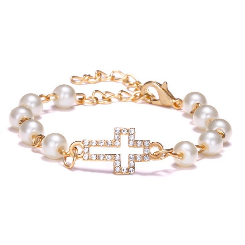 Hollow Rhinestone Pearl Bracelet Multi-style Adjustable $8.50 Dana Fashion Color: Cross Women's Accessories Product information: Treatment Process: Pearl Inlay Color: Cross, 8 words round, Moon XINGX, starfish, butterfly, heart-shaped wings, 8 words Rhine